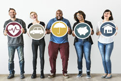Five people standing, each holding a different drawing, being a heart, a car, an umbrella, a piggy bank and a house.
